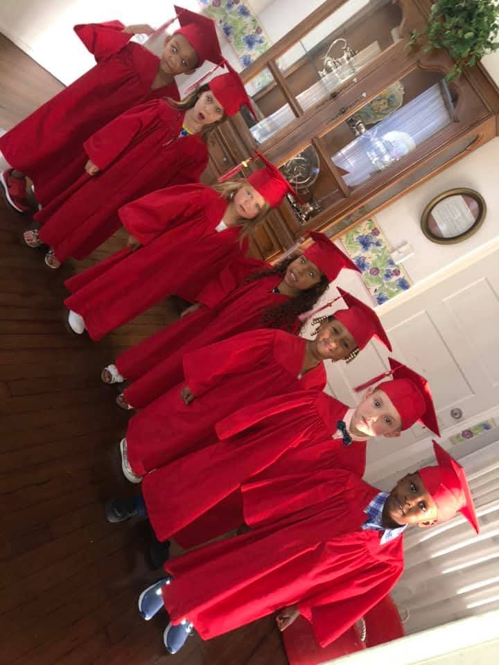 Children in graduation caps